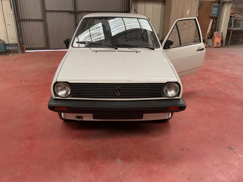 VW-poloshirt uit 1990, Auto's, Voorwielaandrijving, 4 zetels, 4 cilinders, Wit