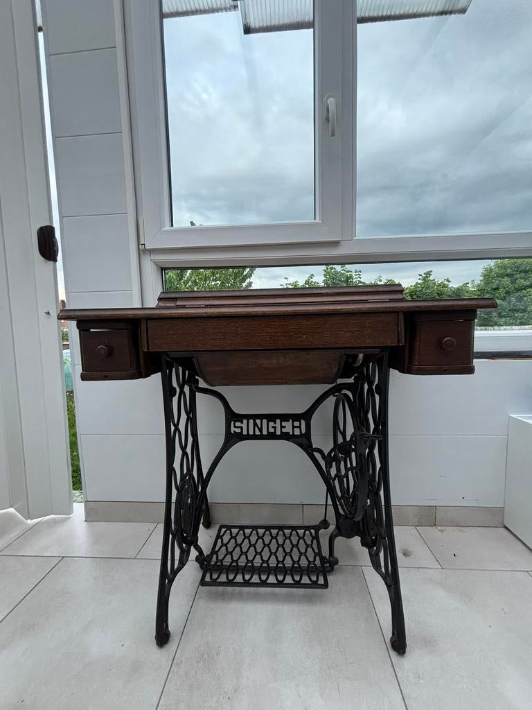 Machine a coudre antique, Ophalen