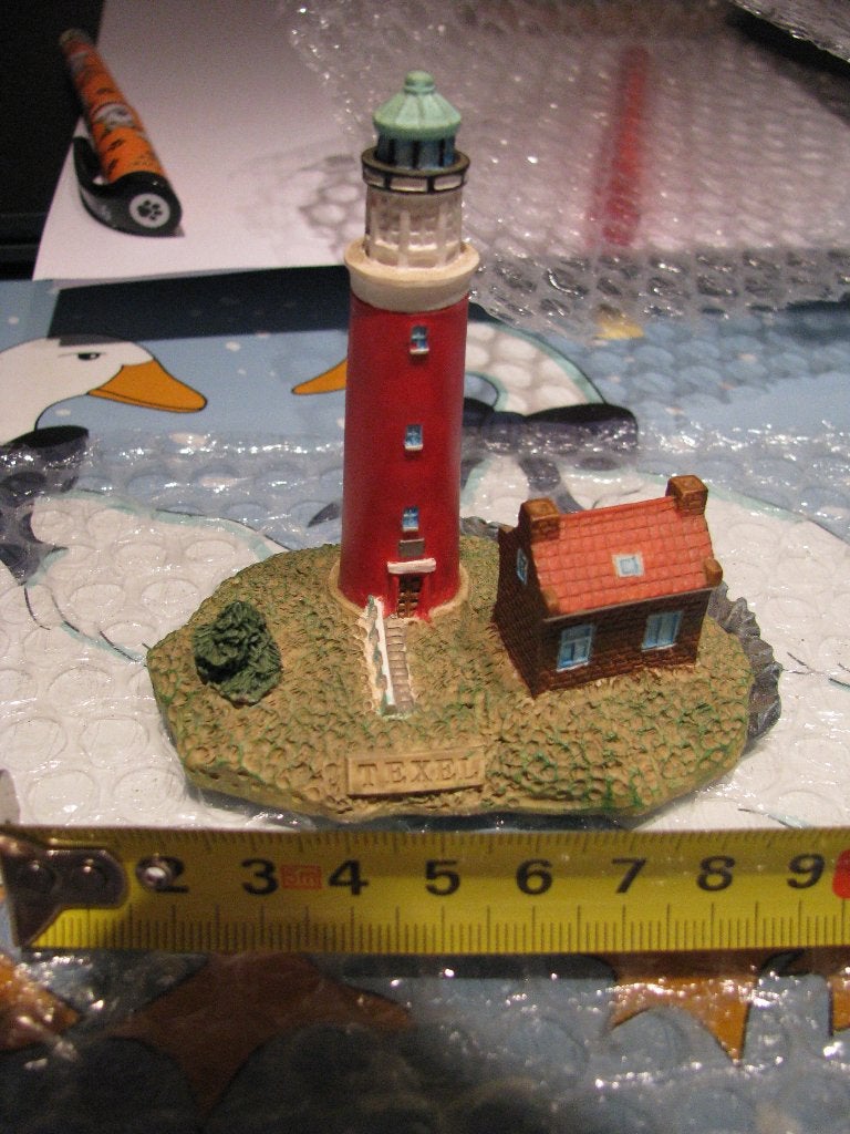 vuurtoren beeldje Nederland - Texel, Ophalen of Verzenden, Zo goed als nieuw, Schaalmodel