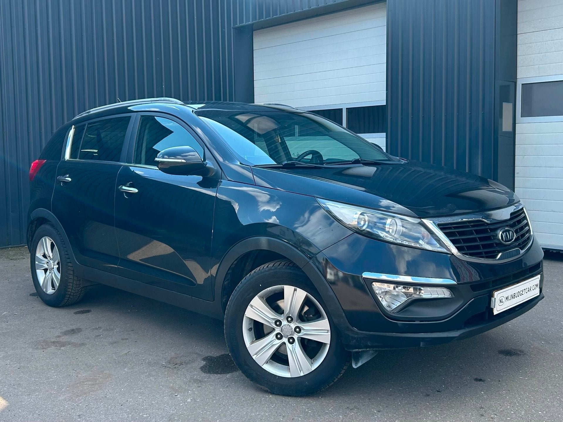 Kia Sportage 2.0 X-ecutive Plus Pack, Auto's, Gebruikt, 4 cilinders, Leder en Stof, Zwart
