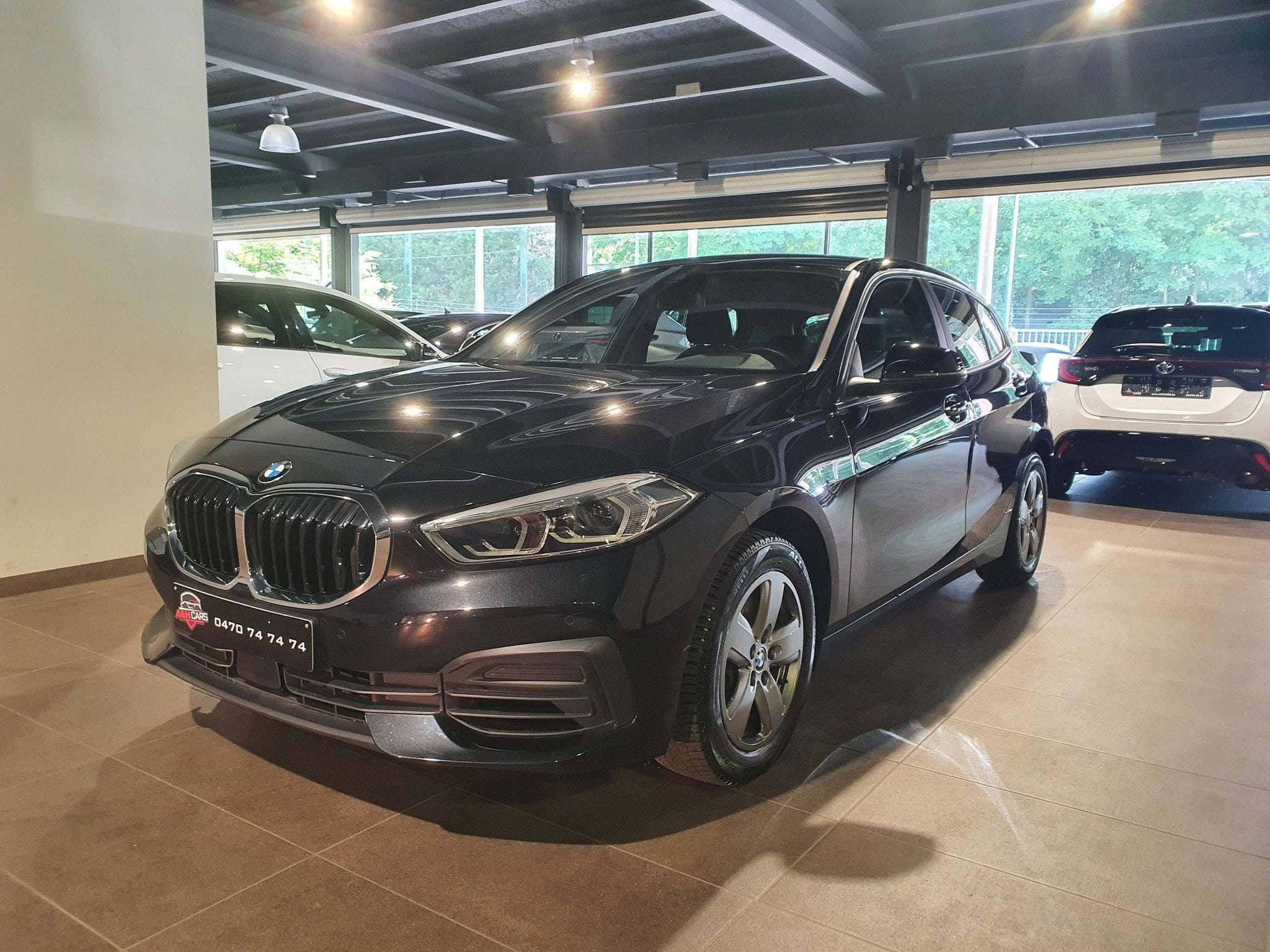 BMW 1 Serie 118 118iA OPF (bj 2019, automaat), Auto's, Gebruikt, Zwart, Bedrijf, 5 deurs