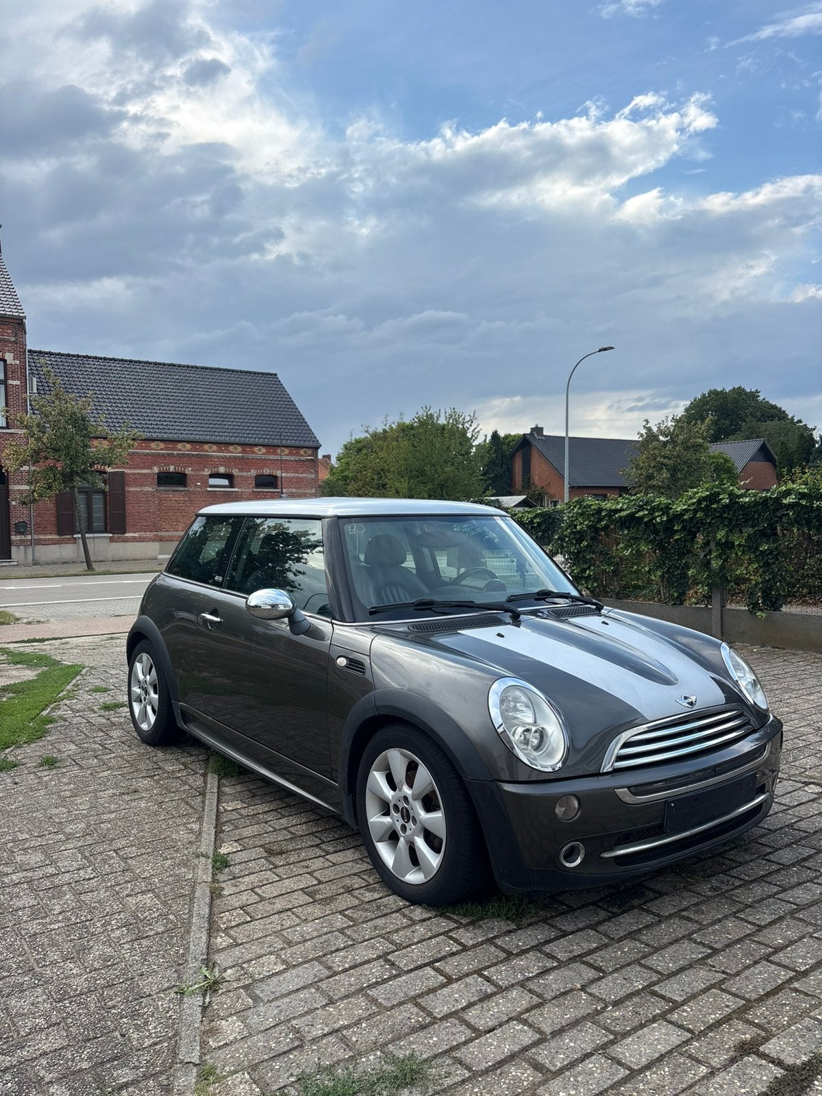 MINI Cooper 1.6 Benzine – 2006 – 131.000 km, Zwart, Handgeschakeld, Particulier, Cooper