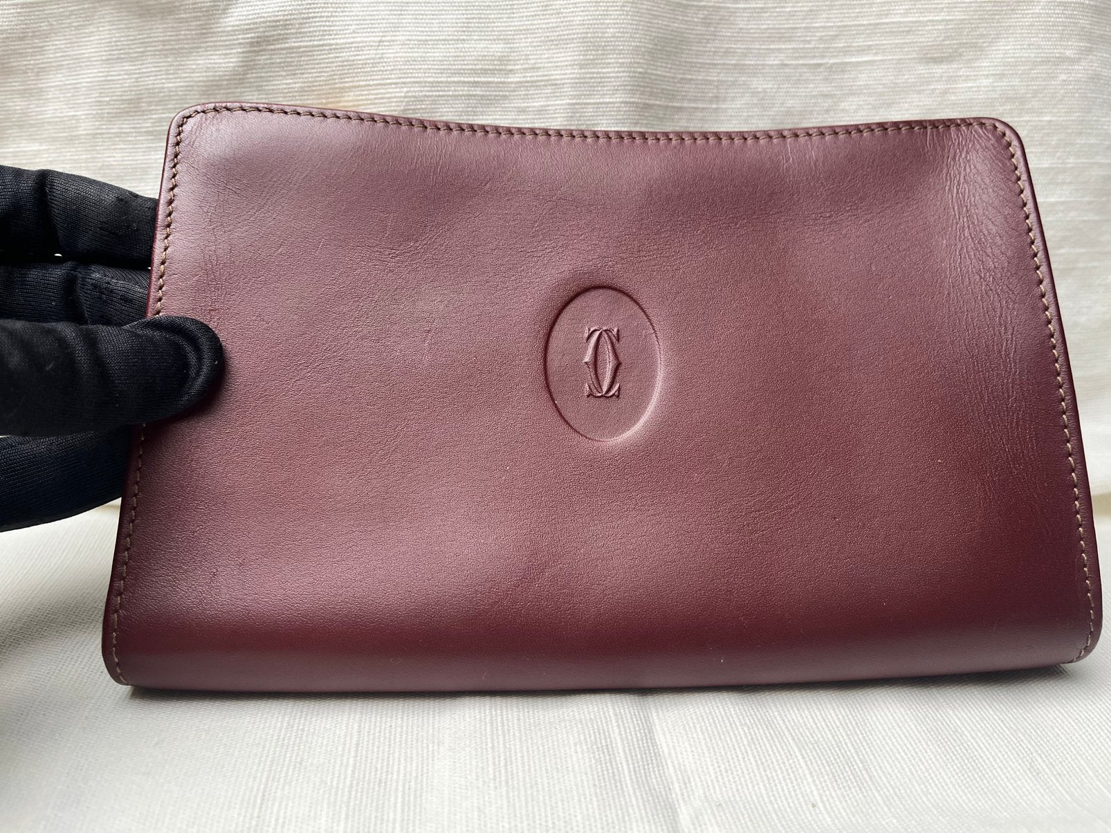 Vintage Must de Cartier bordeauxrode leren poch, Bijoux, Sacs & Beauté, Enlèvement ou Envoi, Utilisé, Rouge, Cuir