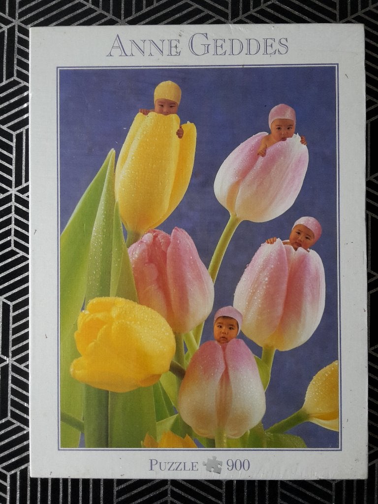 Nieuwe puzzel in folie, Anne Geddes Tulpen, 900 stukjes, Enlèvement ou Envoi, 500 à 1500 pièces, Neuf, Puzzle