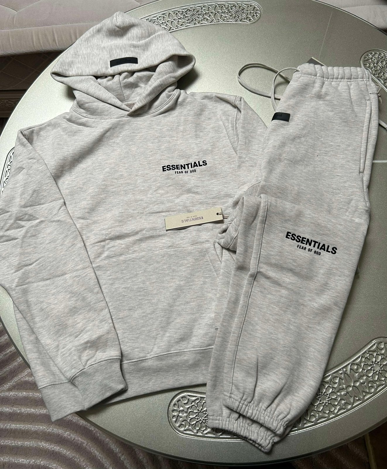 Essentials Trainingspak Light Oat S, Ophalen of Verzenden, Zo goed als nieuw, Maat 46 (S) of kleiner