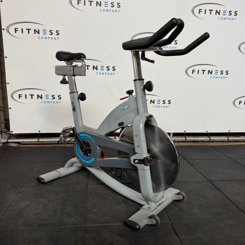 Precor – Teambike 800 – Spinning Bike, Sports & Fitness, Enlèvement ou Envoi, Utilisé, Jambes, Plaques d'haltères