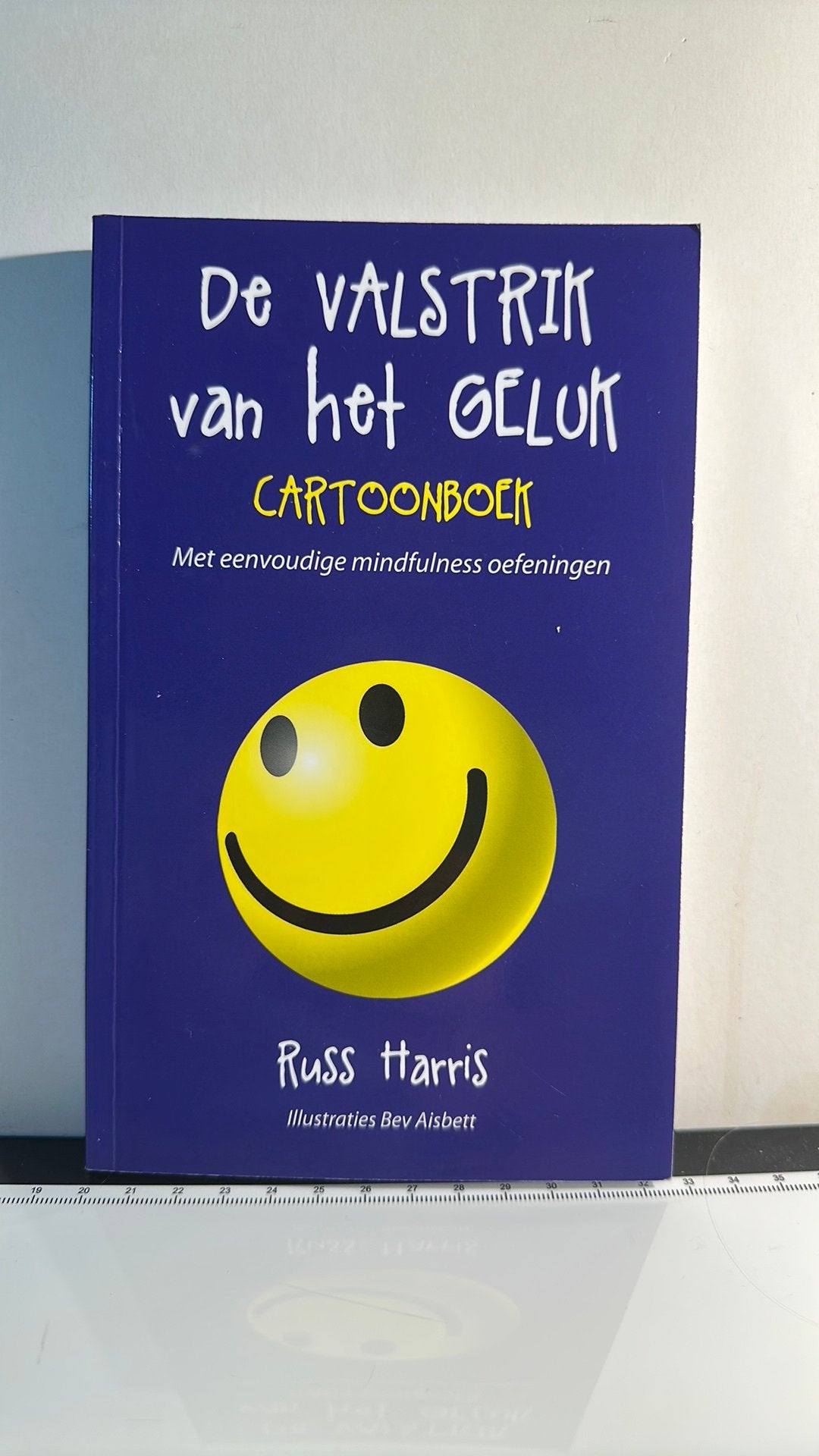 Russ Harris - De valstrik van het geluk cartoonboek, Ophalen of Verzenden, Zo goed als nieuw, Russ Harris