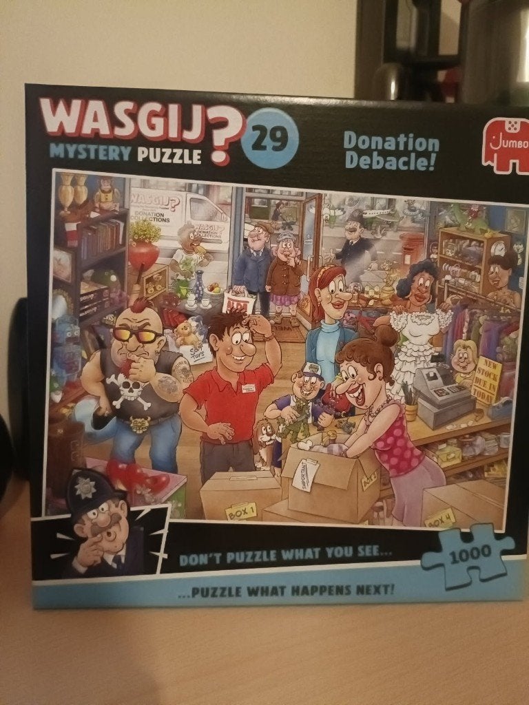 Puzzel Wasgij 29 'Donation Debacle' 1000 stukjes, Enlèvement ou Envoi, 500 à 1500 pièces, Comme neuf, Puzzle