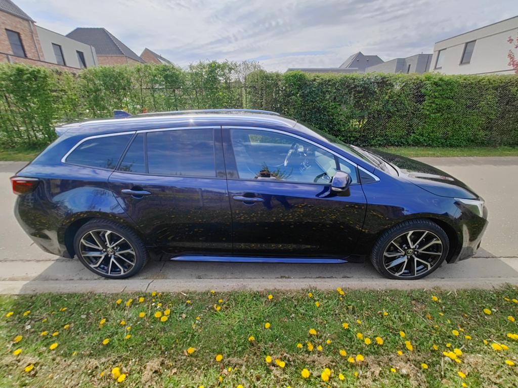 Toyota Corolla 1.8i hybride 2024 25000km 10jaar garantie, Blauw, Break, 5 deurs, Voorwielaandrijving