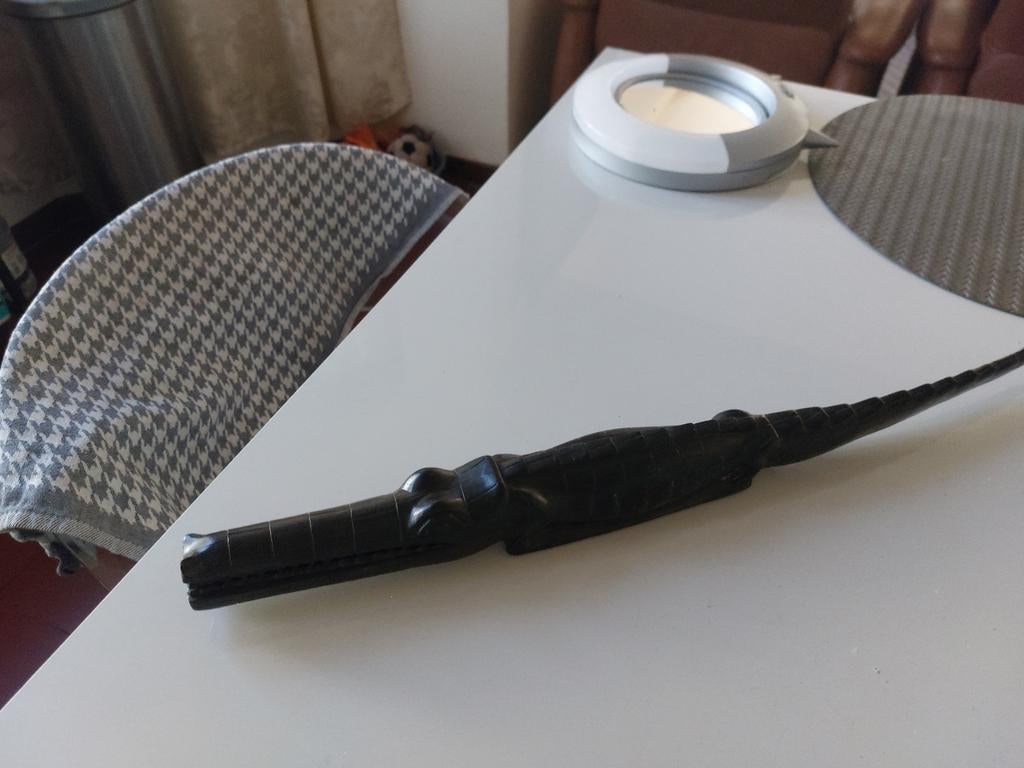 Handgesneden alligator, Ophalen