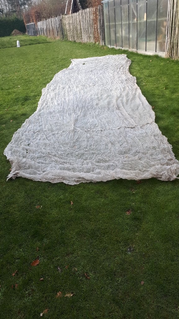 Lichte doek om bv planten af te dekken, Ophalen