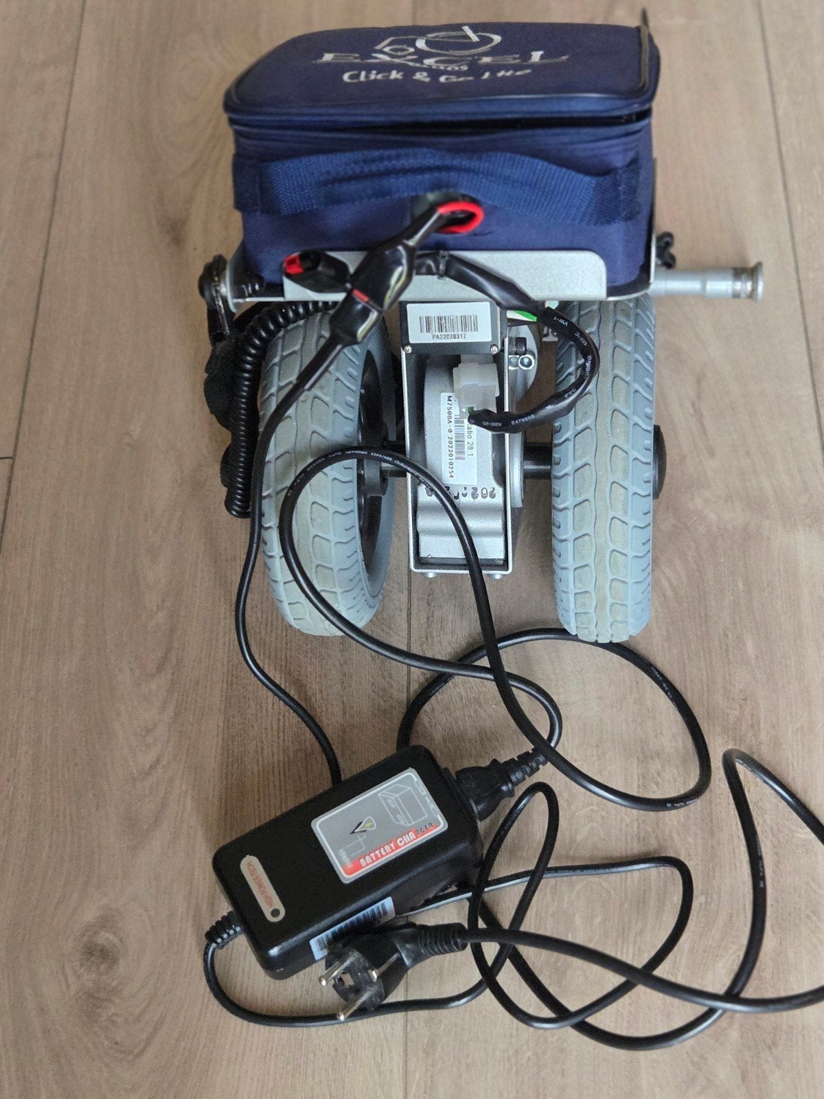 hulpmotor voor begeleiden van rolstoel