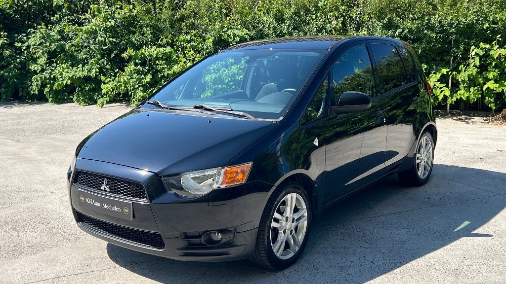 Mitsubishi Colt 1.3i 95pk Automaat Airco Cruise C. Garantie, Auto's, Automaat, Dealer onderhouden, Stof, https://public.car-pass.be/vhr/c1603066-fa52-434f-8d72-5bf3d7faac99