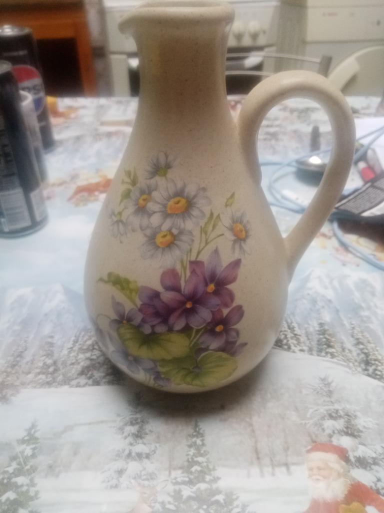 Cruche poterie fleurs, Enlèvement