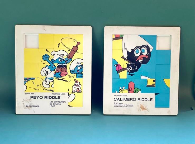 2 puzzles coulissants vintage Les Schtroumpfs et Calimero, Enlèvement ou Envoi