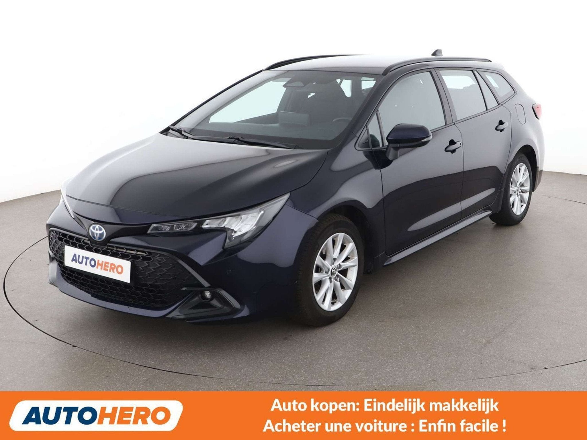 Toyota Corolla 1.8 Hybrid Team D (bj 2023, automaat), Auto's, Stof, Gebruikt, Blauw, Corolla