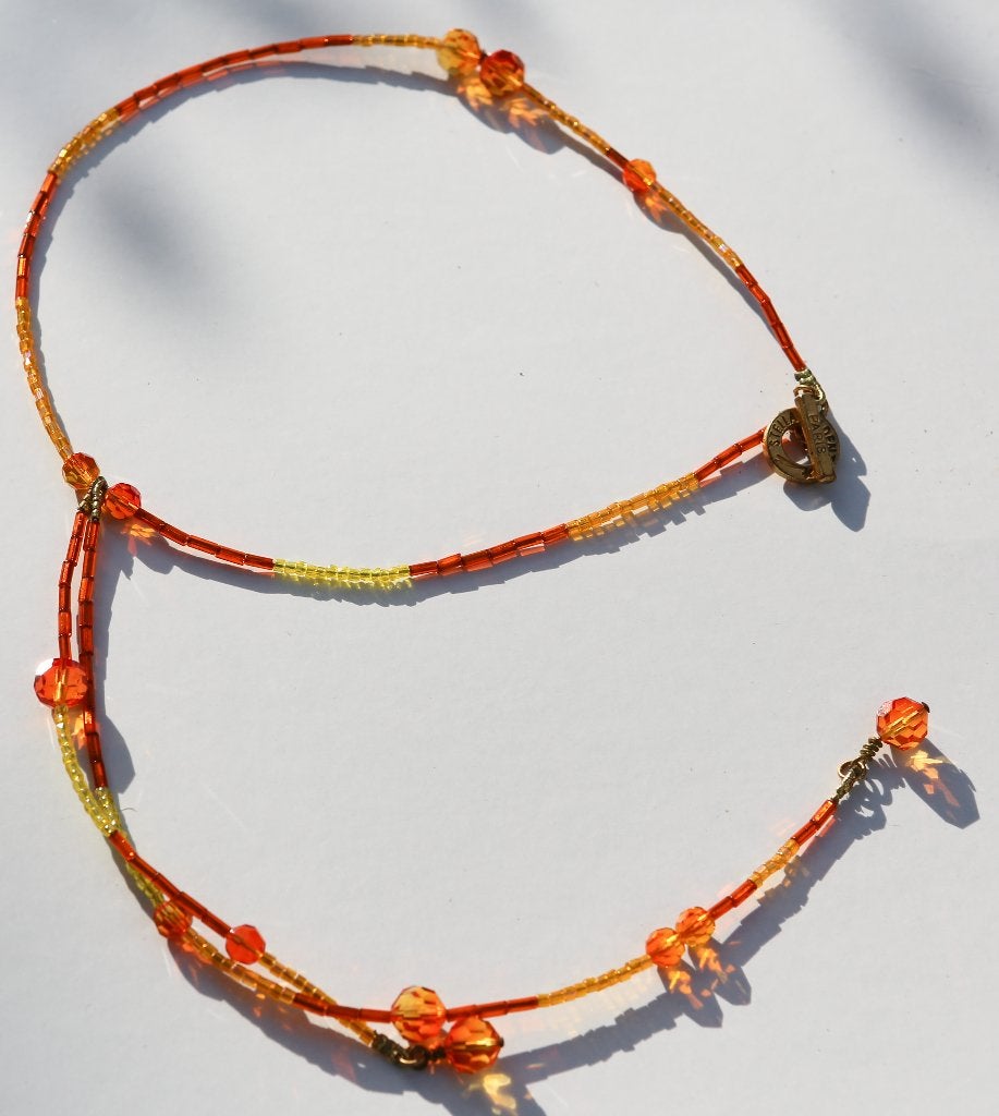 Joli collier orange Stella Cadente, Bijoux, Sacs & Beauté, Colliers, Enlèvement ou Envoi, Comme neuf, Orange