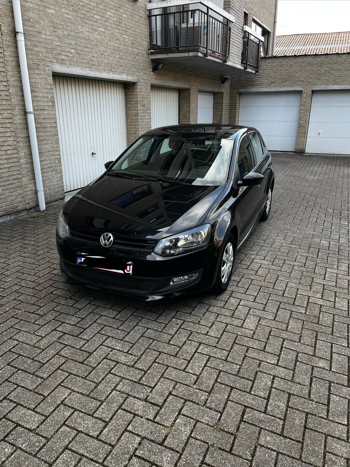 Volkswagen Polo 1.2 benzine 2013, Auto's, Voorwielaandrijving, Stof, Zwart, Zwart