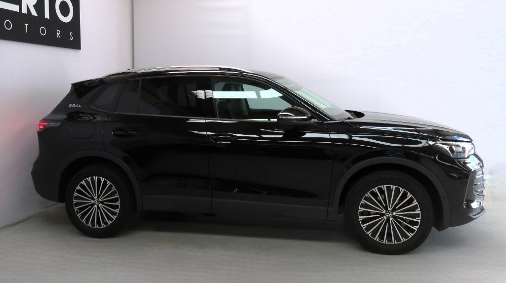 Volswagen Tiguan TSI DSG, Auto's, 1498 cc, 4 cilinders, Leder en Stof, Zwart