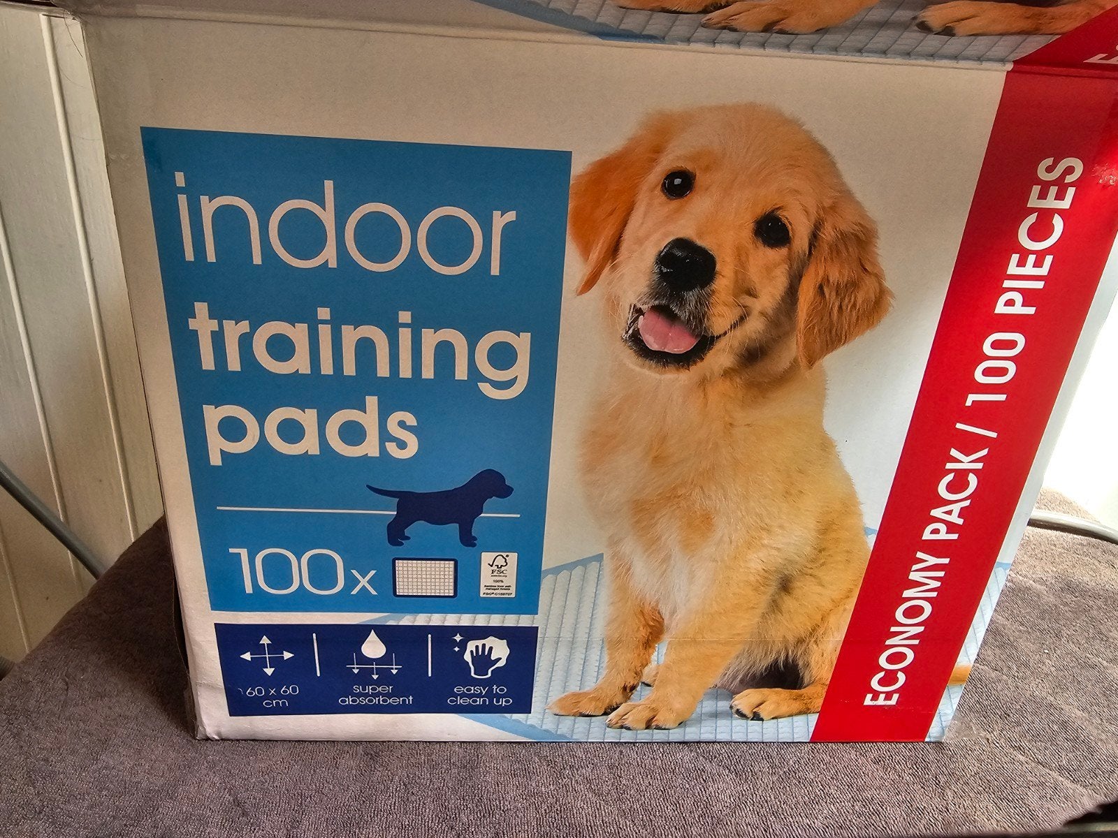 Puppie training om op doek te plassen, Ophalen