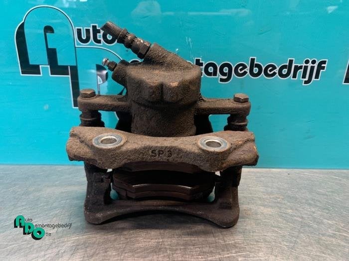 Etrier de frein (pince) avant gauche d'un Citroen C3 (C3 05-, -, 3 mois de garantie, Utilisé, -