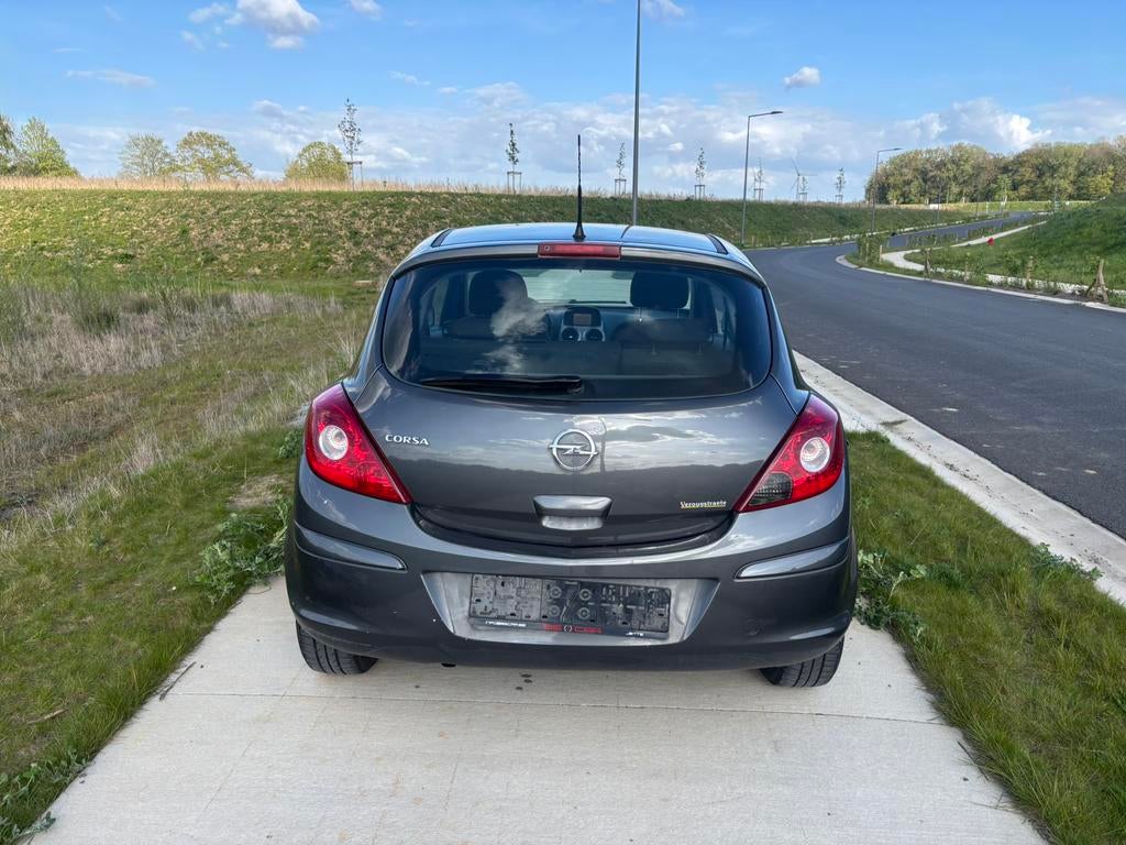 Opel Corsa 1.2i Essence année 2013 Euro 5 avec airco, Auto's, Stof, Zwart, 4 cilinders, Bedrijf