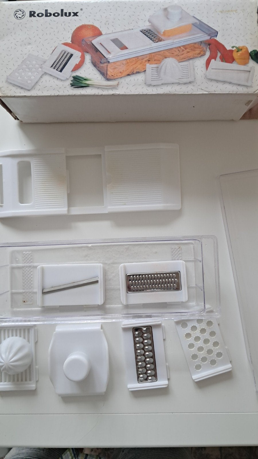 Keukenmandoline met accessoires, Ophalen