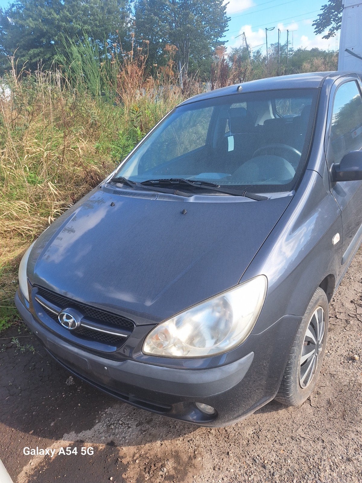 Hyundai Getz ==> MOET DRINGEND WEG, Auto's, Voorwielaandrijving, Stof, Zwart, Blauw
