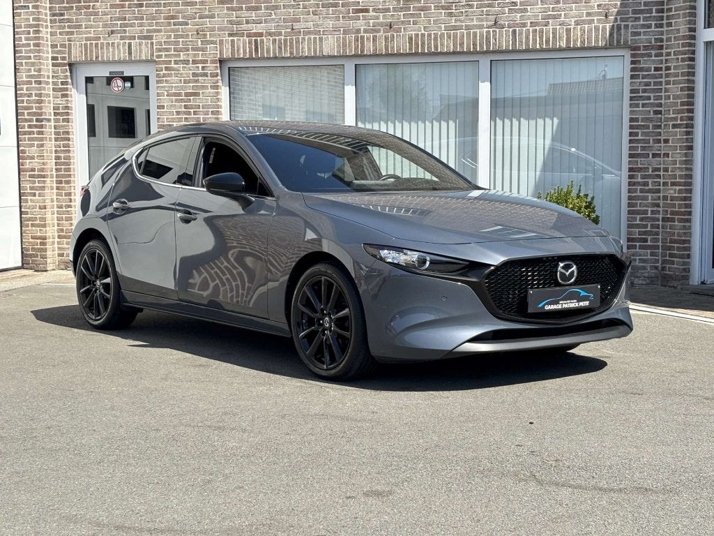 Mazda 3 2.0 M-HYBRID HOMURA (150pk) / 33000km / 12m wb, Autos, Argent ou Gris, 140 g/km, Entretenue par le concessionnaire, Noir
