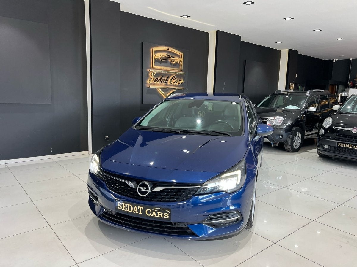 OPEL ASTRA SPORTS TOURER+ 1.2 BENZINE VAN 1STE EIGENAAR, Auto's, Gebruikt, Euro 6, 1199 cc, Blauw