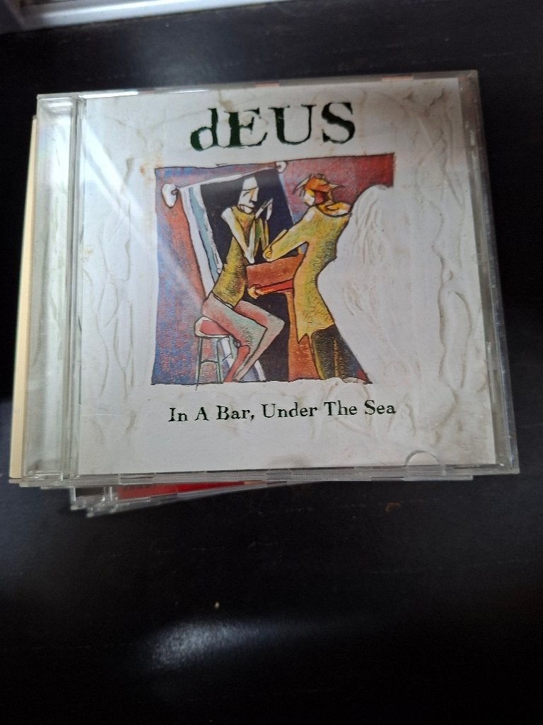 cd - deus - in a bar under the sea, Cd's en Dvd's, Cd's | Rock, Ophalen of Verzenden, Zo goed als nieuw, Inclusief boekje, Indie Rock