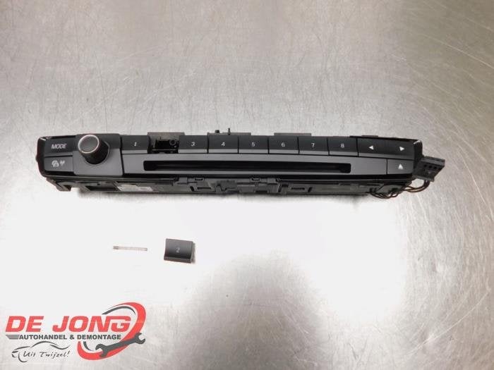 Panneau commande radio d'un BMW 1-Serie, -, 3 mois de garantie, Utilisé, -