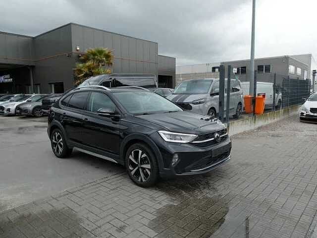 Volkswagen Taigo 1.0 TSi 110pk Automaat Business Luxe, Auto's, Automaat, Verwarmde buitenspiegels, Zwart, Bedrijf