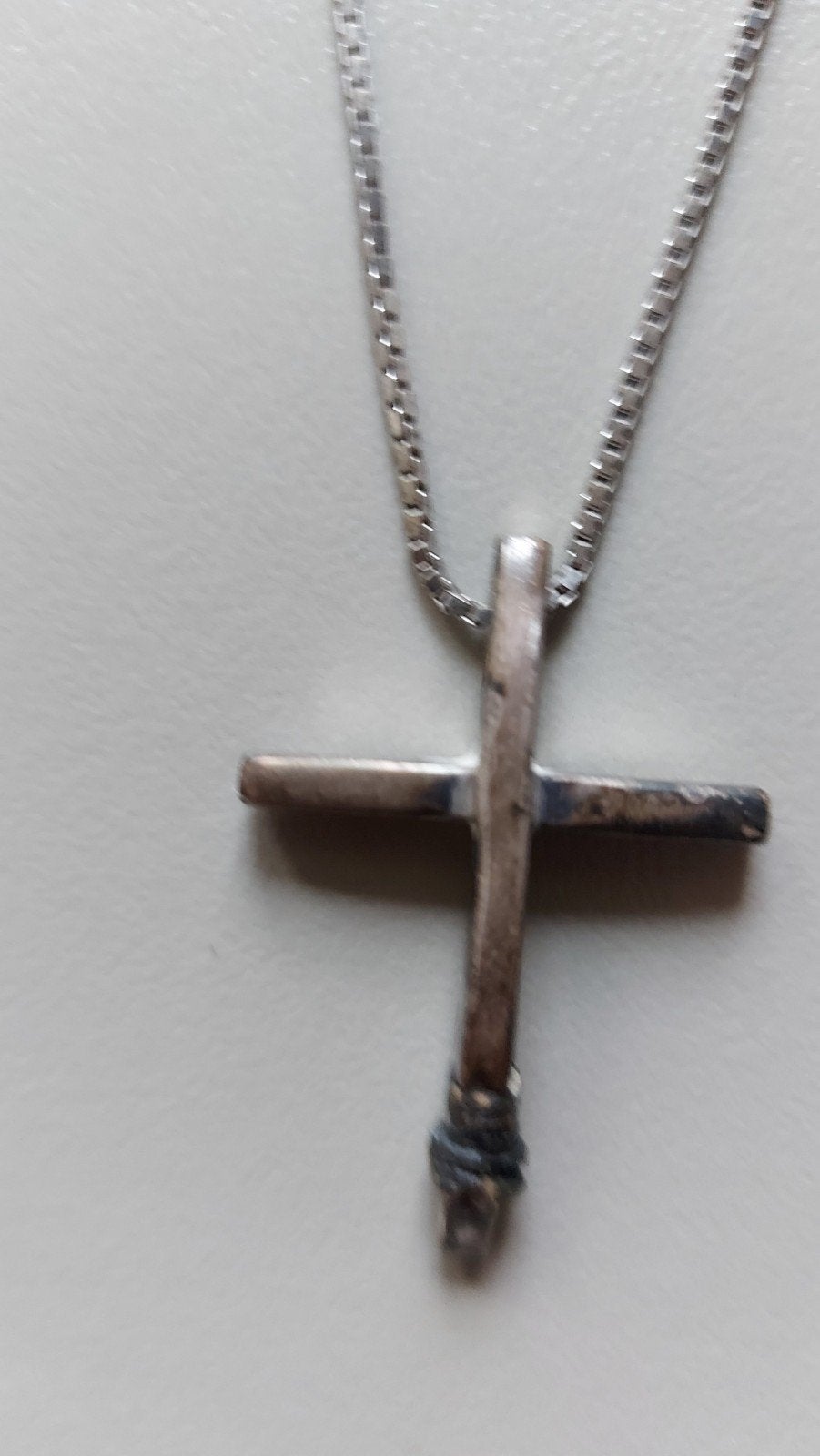 zilveren ketting met zilveren kruis, Ophalen
