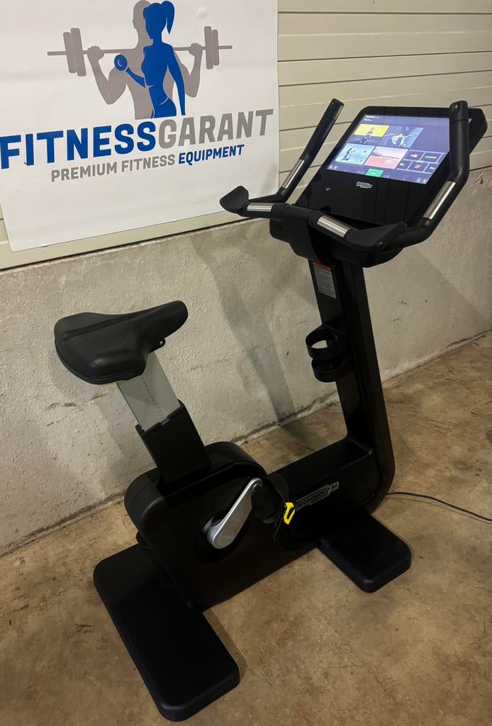 Vélo vertical Technogym Artis, vélo d'exercice Unity 4 Live, Enlèvement ou Envoi, Comme neuf