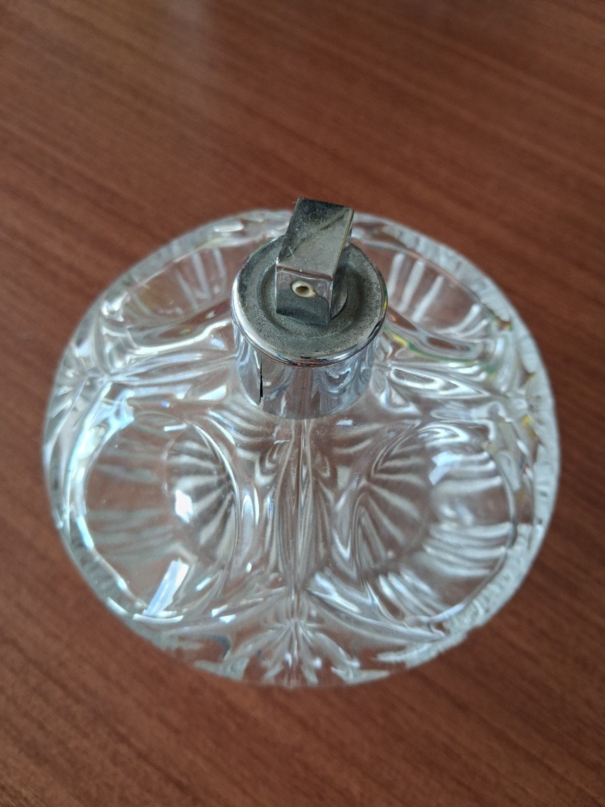 parfumflesje uit geslepen kristal, Ophalen