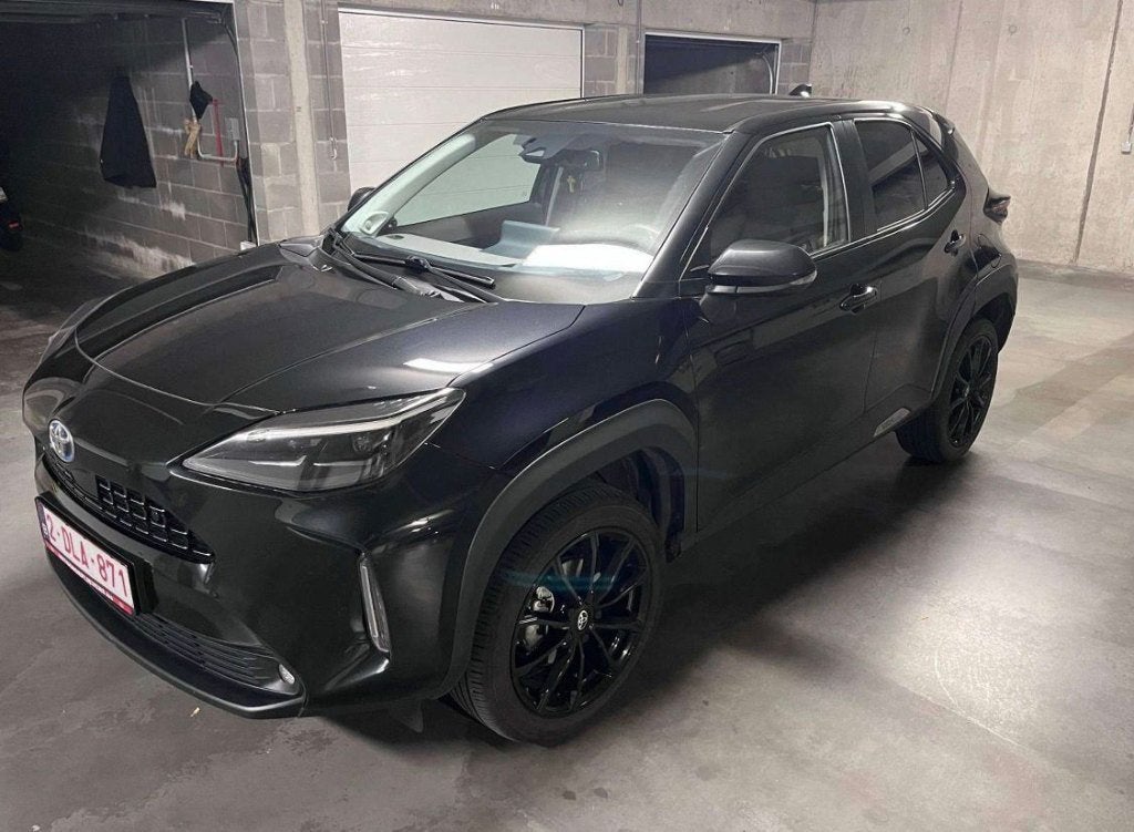 Toyota Yaris Cross Hybrid 1.5i VVT-i E-CVT Elegant, Auto's, Toyota, 1290 kg, Leder en Stof, Zwart, 1490 cc