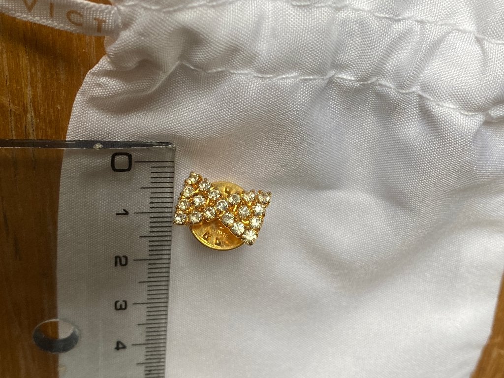 Broche met strikje met strass, Ophalen of Verzenden, Nieuw, Goud, Met strass