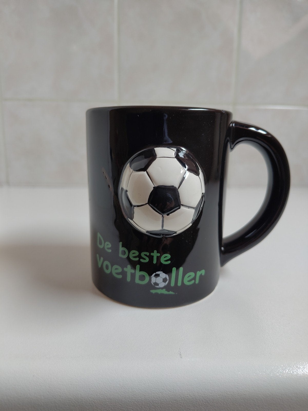 Zwarte mok (tas), de beste voetballer., Overige materialen, Overige typen, Ophalen of Verzenden, Zo goed als nieuw