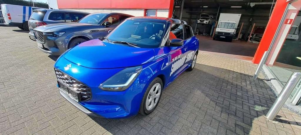 Suzuki Swift 1.2i SHVS Grand Luxe + 12V, Auto's, Gebruikt, Blauw, Swift, Bedrijf