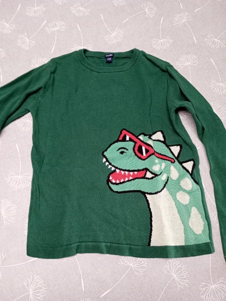 8A Pull vert dinosaure, Enlèvement