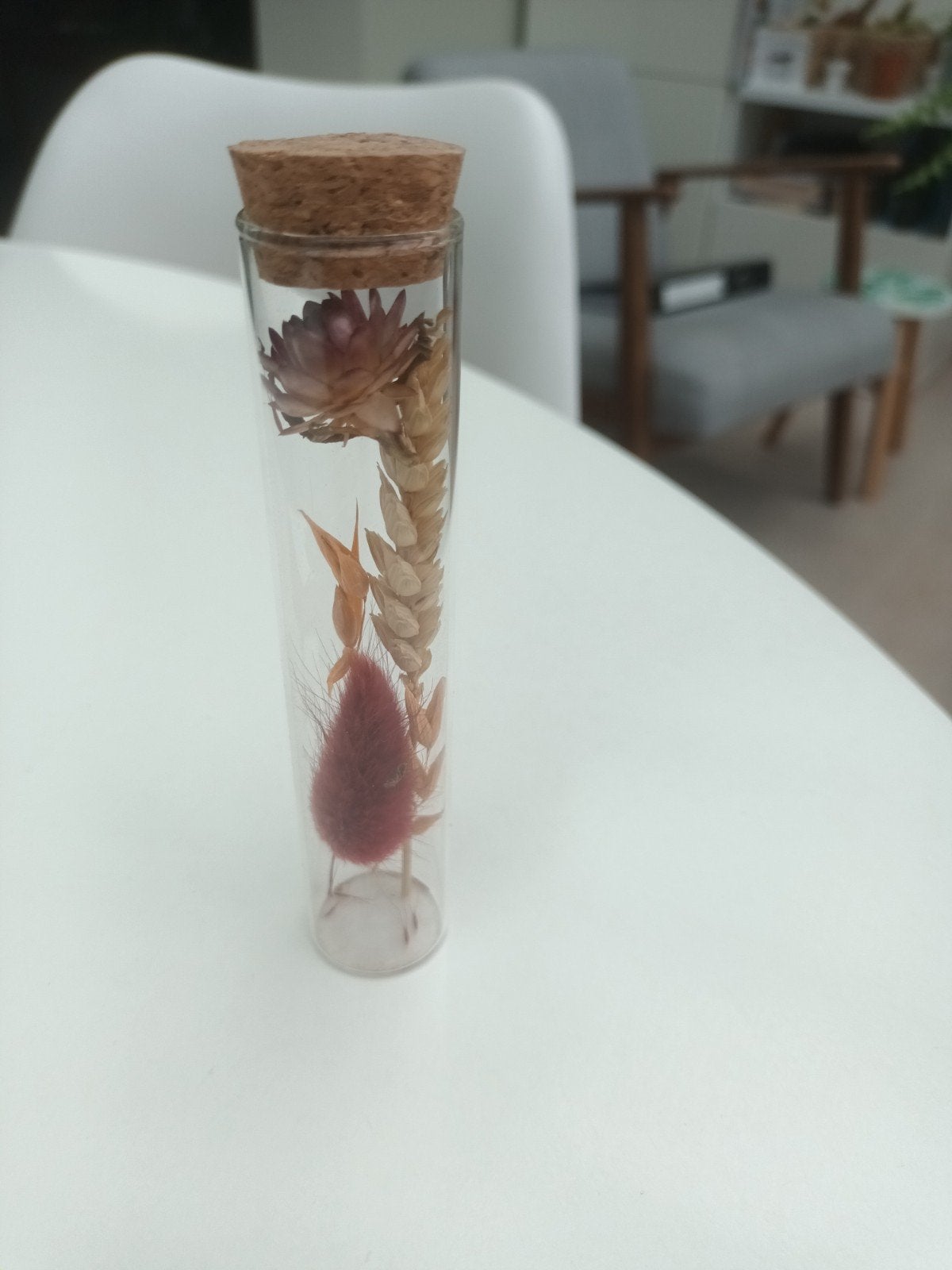 Glaasje met gedroogde bloem, Ophalen