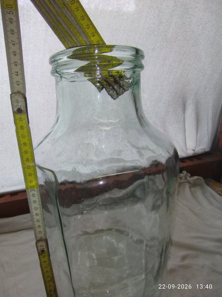 Grote glazen fles, Ophalen