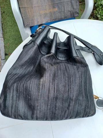 DELVAUX vintage Zwarte geweven leren tas met het CATOGAN-log beschikbaar voor biedingen