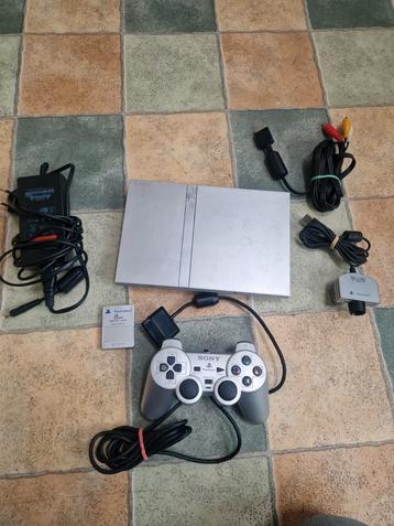 PS2 Slim Édition Grise + Manette + Carte Mémoire + Caméra disponible aux enchères