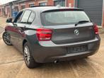 BMW 1 SERIE✅ 116iA AUTOMAAT OPEN DAK GARANTIE CARPLAY, Auto's, Euro 5, Zwart, 5 deurs, Velours