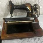 Antieke naaimachine, Ophalen