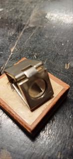 Mini vergrootglas, Ophalen
