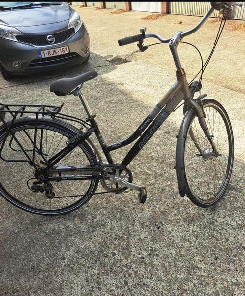 ✅’RALEIGH’ Damesfiets 28Inch+7SPEED+Framemaat 45Cm✅, Fietsen en Brommers, Fietsen | Dames | Damesfietsen, Zo goed als nieuw, Versnellingen
