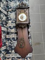 Antieke slingerklok, Ophalen